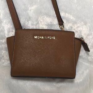 Michael Kors tan purse. Aprox. 5x7 inches